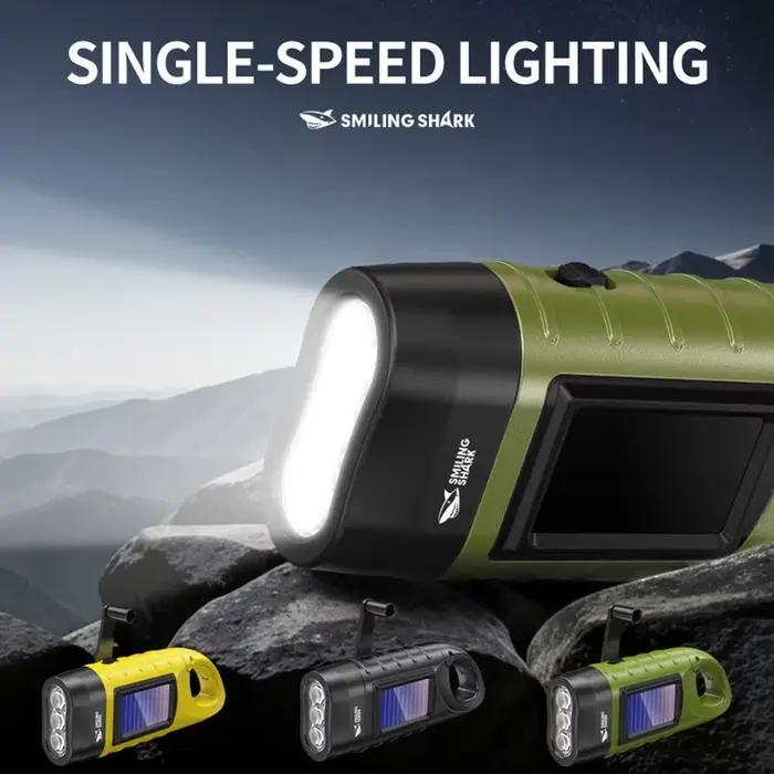 Lampe de poche LED énergie solaire pour camping alpinisme et situations d'urgence trois couleurs émission ABS robuste recharge manivelle ou énergie solaire distance d'éclairage 100-200 mètres